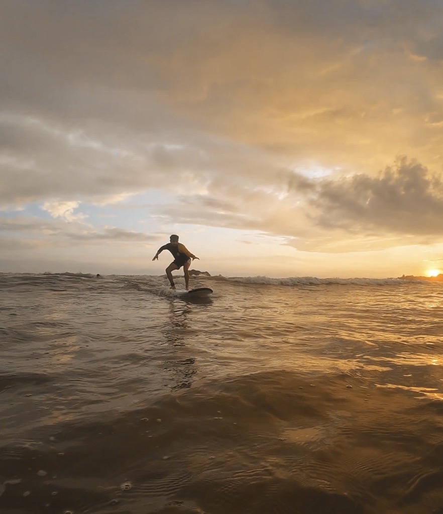 Surfing at sunset